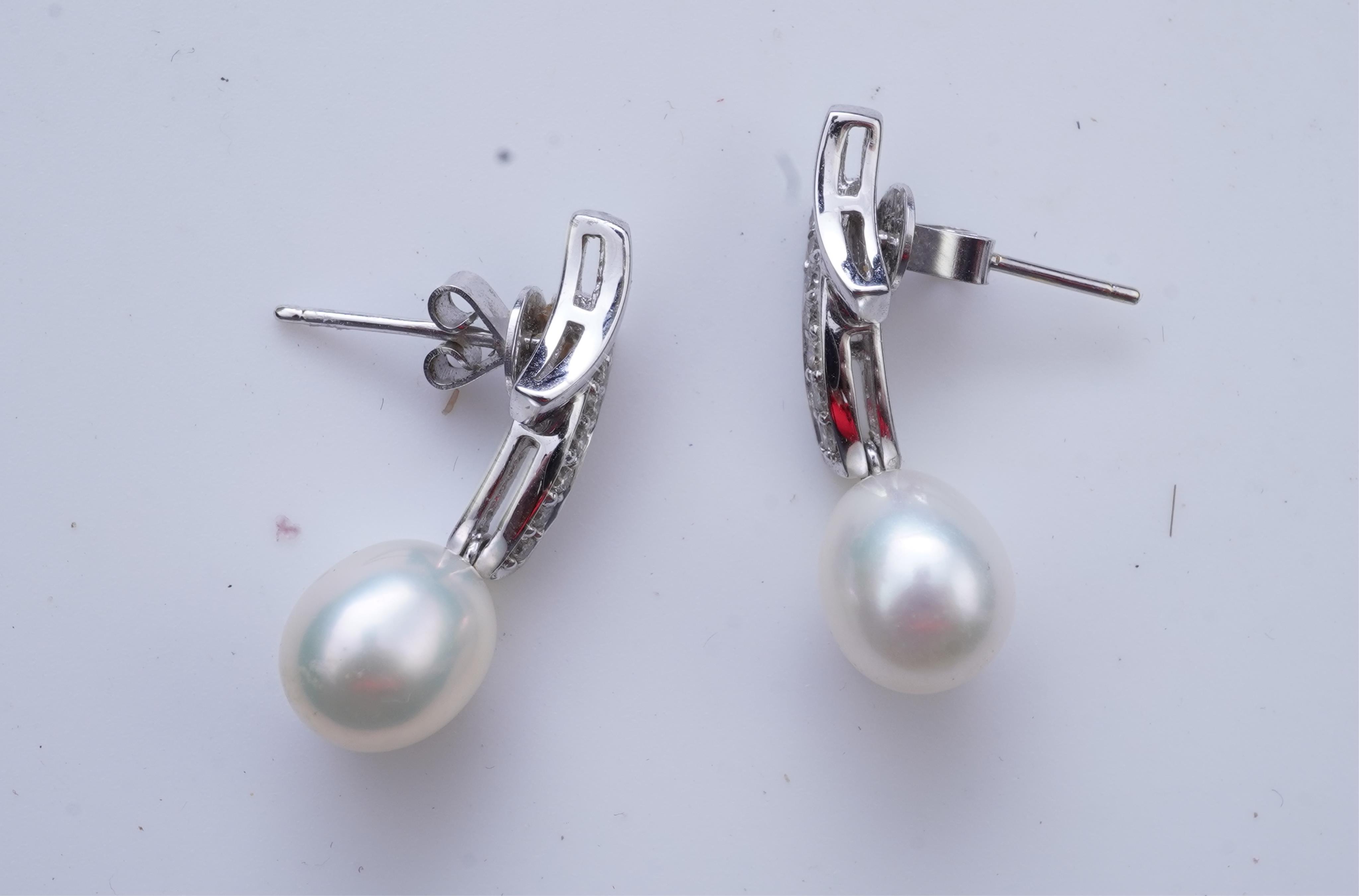 A cultured pearl and diamond demi-parure